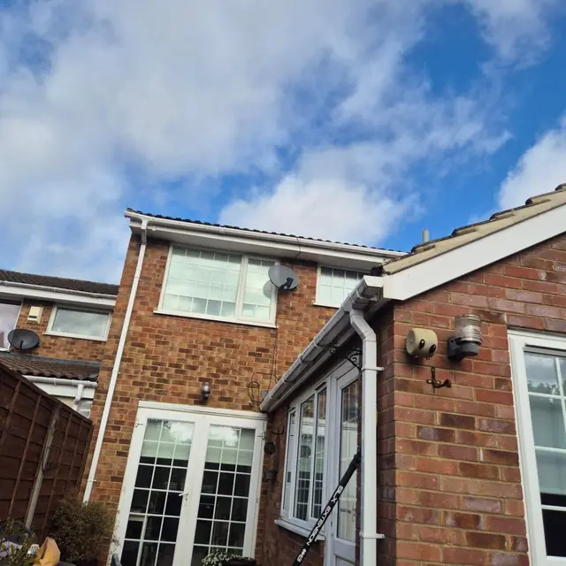 Rear of a house with clean windows, doors and gutters